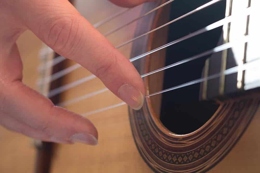 how to play guitar with long nails