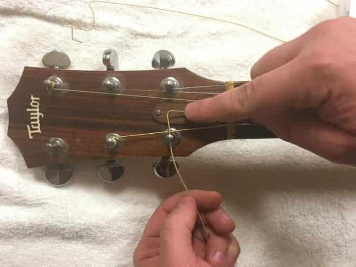 How do you tighten loose guitar strings